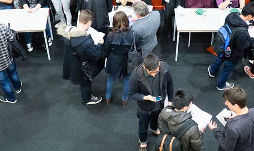 people at a workshop seen from the top